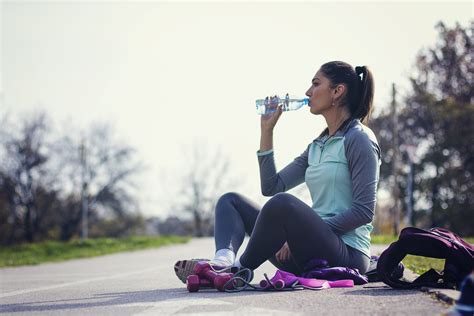Fitness Woman Drinking Water From Bottle Suntheanine