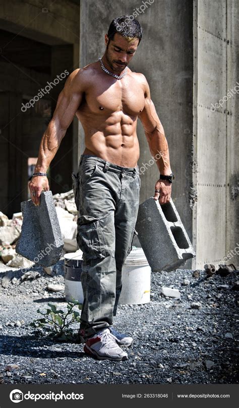 Sexy Construction Worker Shirtless Showing Muscular Body Holding Big