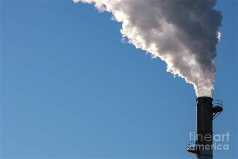 Smokestack Billows Thick Smoke Into Blue Sky Photograph By Colin Temple