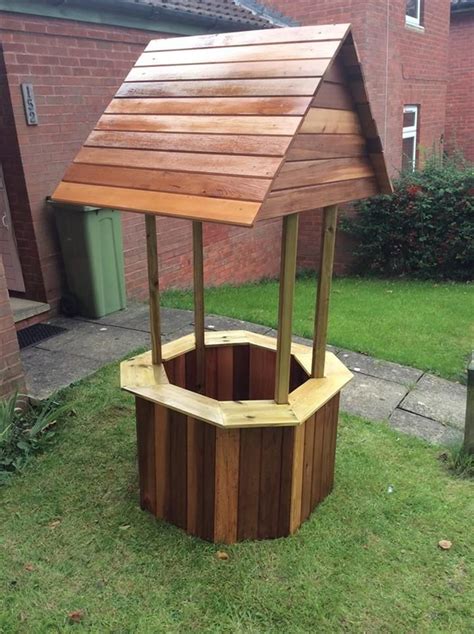 Add a magical well to your house! Wood Pallet Wishing Well | Pallet furniture outdoor, Wood ...