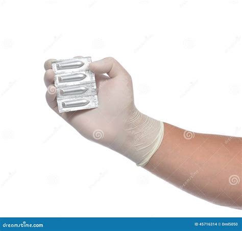 Mão Médica Com Medicina Retal Vaginal Dos Comprimidos Do Supositório