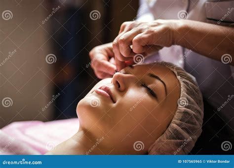 Calm Girl Having Spa Facial Massage In Luxurious Beauty Salon Stock
