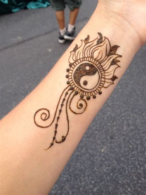 Picture Of Symbolic Yin And Yang Tattoo On The Wrist