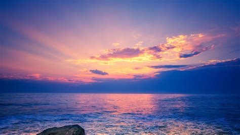 Light Purple Sky Above Beach Rock 4k Hd Nature Wallpapers