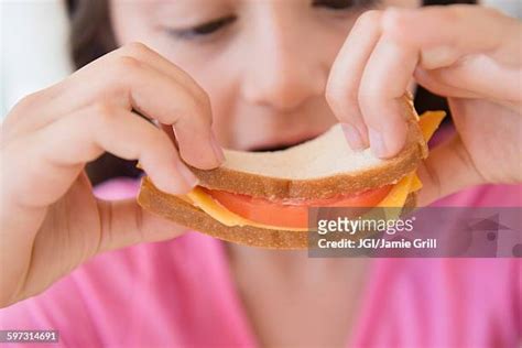 Eating Cheese Sandwich Photos And Premium High Res Pictures Getty Images