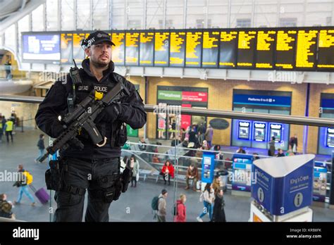 Armed British Transport Police Officers On Patrol At Kings Cross Station In London As The Force