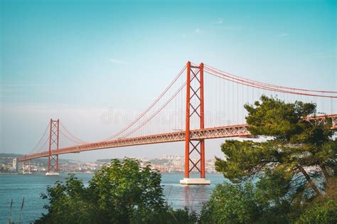 25 De April Bridge Red Bridge Is Connecting Lisbon And Almada Across