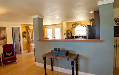 A denver bungalow gets an updated floor plan by removing the wall between the kitchen and the dining room, the most requested construction task in our older inner city neighborhoods. 13 Affordable Half Wall In Kitchen For Breakfast Bar Idea