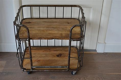 Trolley (plural trollies or trolleys). Trolley / Bakkerskar bruin - www.blossombrocante.nl