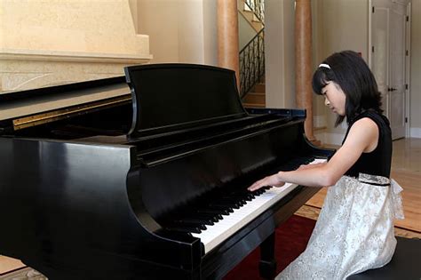 Girl Playing Piano Stock Photos Pictures And Royalty Free