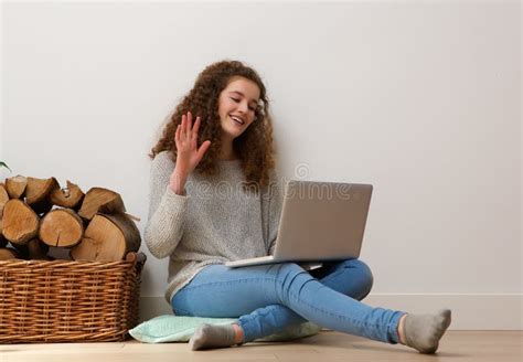 Teenage Girl Using Laptop And Waving Hello On Chat Stock Photo Image