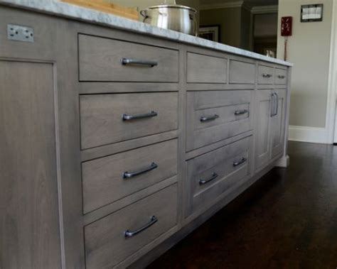 Gray cabinets also work with any wood tone, so you can choose stained mahogany cabinets for the island, for example, and a cement gray for the wall cabinets. Grey Stained Cabinets Home Design | Gray stained cabinets, Staining cabinets, Staining oak cabinets