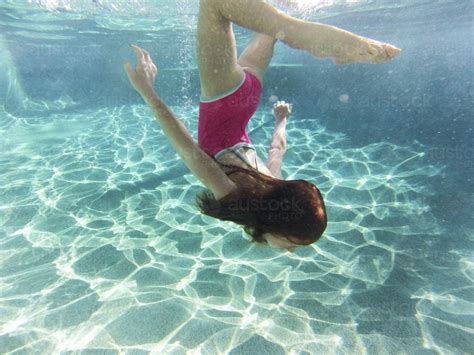 Image Of Girl Swimming Underwater In A Pool Austockphoto