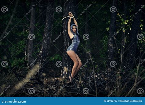 A Girl Tied To A Tree In A Forest Dark Forest Esoterics Stock Image