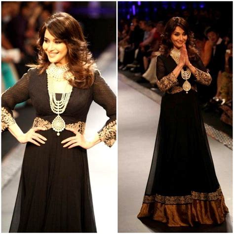 The New Trend In Anarkali Suits Black Adorns It And Gold Glitters