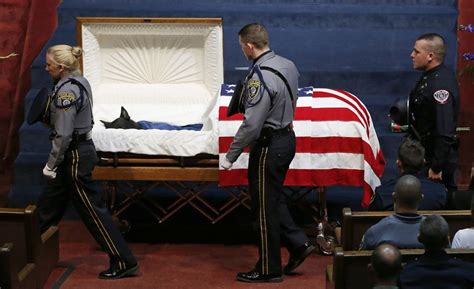 Police Officers File Past The Casket Of Oklahoma City Police Canine