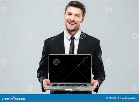 Happy Attractive Young Businessman Holding Blank Screen Laptop Stock