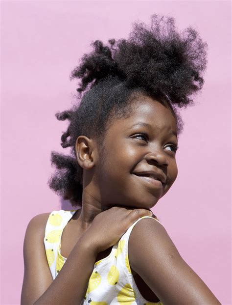 From the higher part of the hair, all the dreads are pulled up in a wrapped bun. 71 Cool Black Little Girl's Hairstyles for 2020-2021 ...