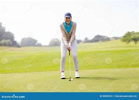 Female Golfer Putting Her Ball Stock Image Image Of Shirt Putting
