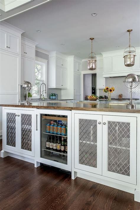 Bold and colorful, or sleek and minimalist? Grilles and wire mesh cabinet door This kitchen island features Butcher countertop and a panel ...