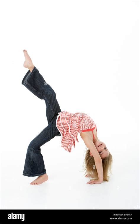 Young Girl Doing Backflip In Studio Stock Photo Alamy