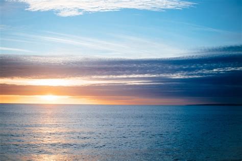 Free Photo Beautiful Scenery Of Sunset Over The Peaceful Sea
