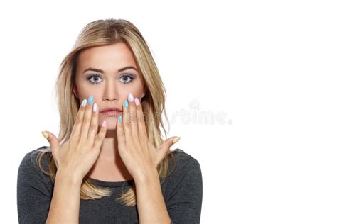 Young Beautiful Girl Holding Her Fingers To Her Face Showing Manicure