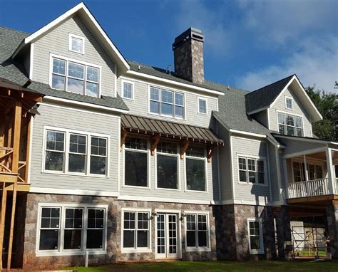 Faux stone siding is rising in popularity due to its affordability and practicality. Field Stone - Rustic | Stone siding, Stone veneer siding ...