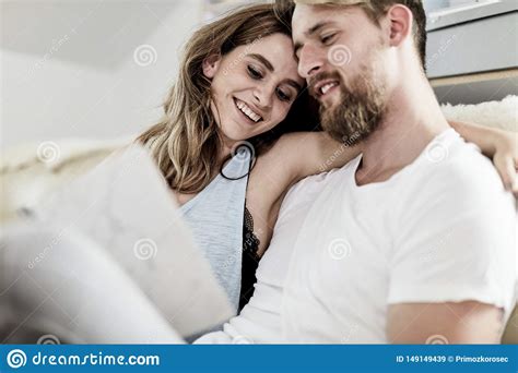 Close Up Of Husband And Wife Relaxing On The Couch Stock Image Image Of Home Husband