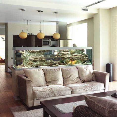A Living Room Filled With Furniture And A Large Fish Tank In The Middle