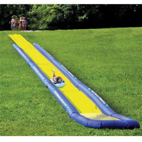 Part water slide, with two slides and a splash pool. The World's Longest Backyard Water Slide - Hammacher Schlemmer