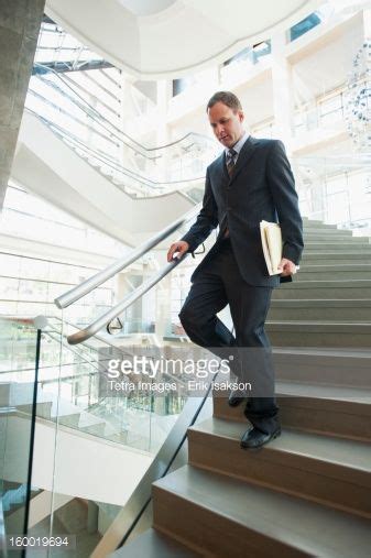 Usa Utah Salt Lake City Man Walking Down Stairs In Office Pose
