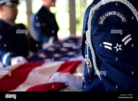 Us Air Force Mile High Honor Guard Members Fold A Flag During A