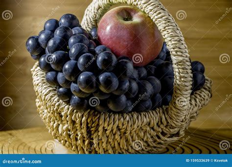 Apples And Grapes In A Basket On A White Background Stock Image