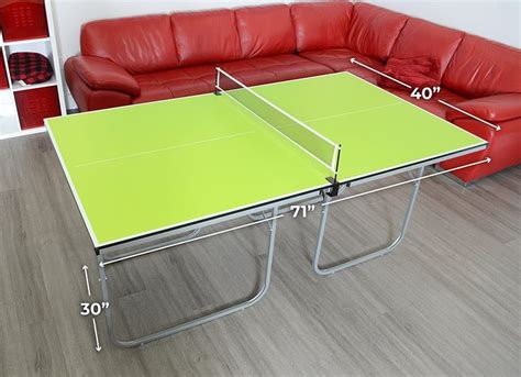A Couch And Table In A Room With Measurements For The Top Part Of The Table