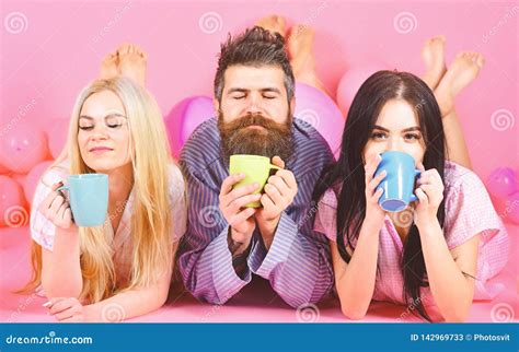 Threesome Relax In Morning With Coffee Lovers Concept Man And Women Friends On Sleepy Faces