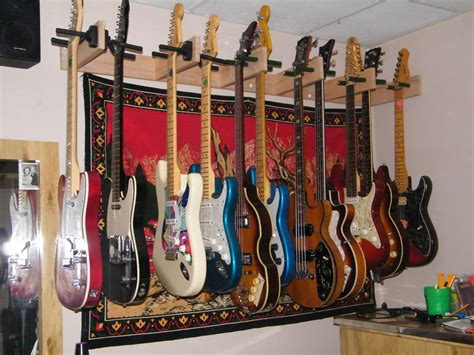 This guitar wall hanger is easy to install and has a great value for the price. wall mounted guitar rack (With images) | Guitar wall ...