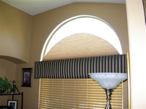 If you are willing to cover the window partially with drapes, especially if they were sheers, you could use drapes. Classic and Original Arch Window Blinds | Window ...