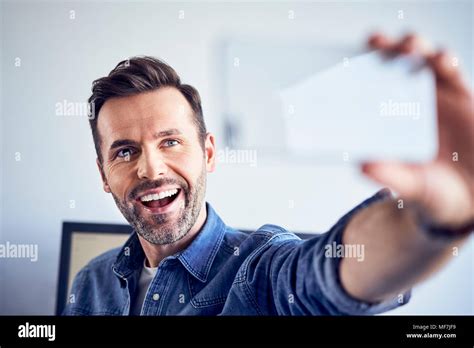 Happy Man In Office Taking Selfie Stock Photo Alamy