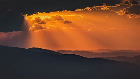 Download Wallpaper 2560x1440 Mountains Sunset Clouds Rays Dusk