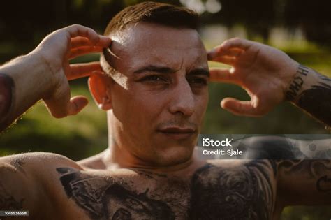 Close Up Of A Man Doing Sit Ups Outside Stock Photo Download Image