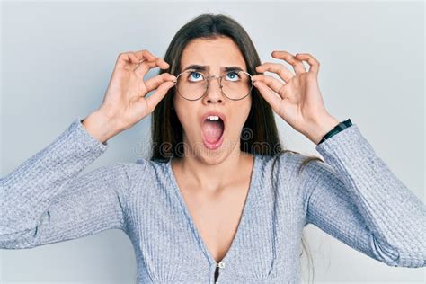 Young Brunette Teenager Wearing Glasses Angry And Mad Screaming