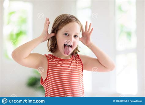 Child Funny Face Kid Teasing Girl Laughing Stock Photo Image Of