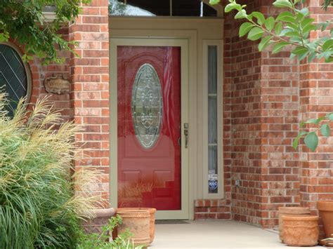 Red Front Door With Light Colored Storm Door