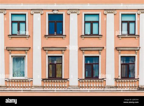 Several Windows In A Row On The Facade Of The Urban Historic Apartment