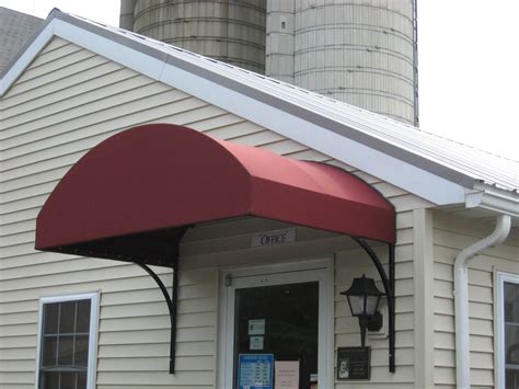 Arched Canvas Commercial Awning Installed Over A Door Kreiders