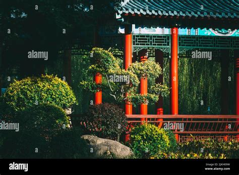 A Beautiful View Of Chinese Pavilions In A Garden With Plants Stock