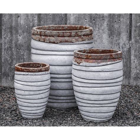 A planter that'd happily house little shrubs and succulents might not be sturdy enough for the larger lemon trees either side of your front door. Guaracha White Large Ceramic Plant Pots | Kinsey Garden Decor