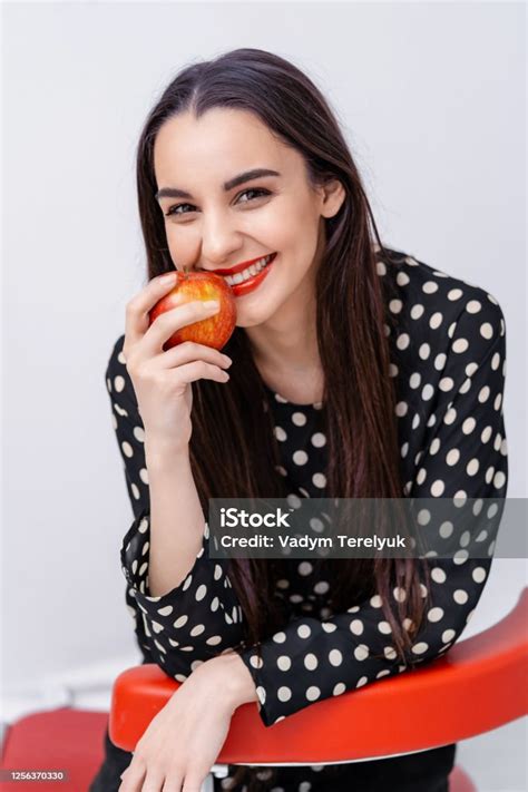 Beautiful Young Pretty Woman Model Girl With Red Lips Girl Eating An Apple Smiling Closeup Stock