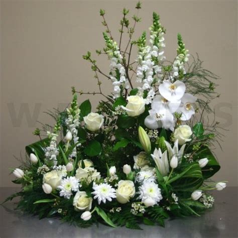 Unlike flower wreaths, floral baskets can be sent directly to the church, funeral parlor or the home of the deceased. Harmony Urn Arrangement - W Flowers Ottawa